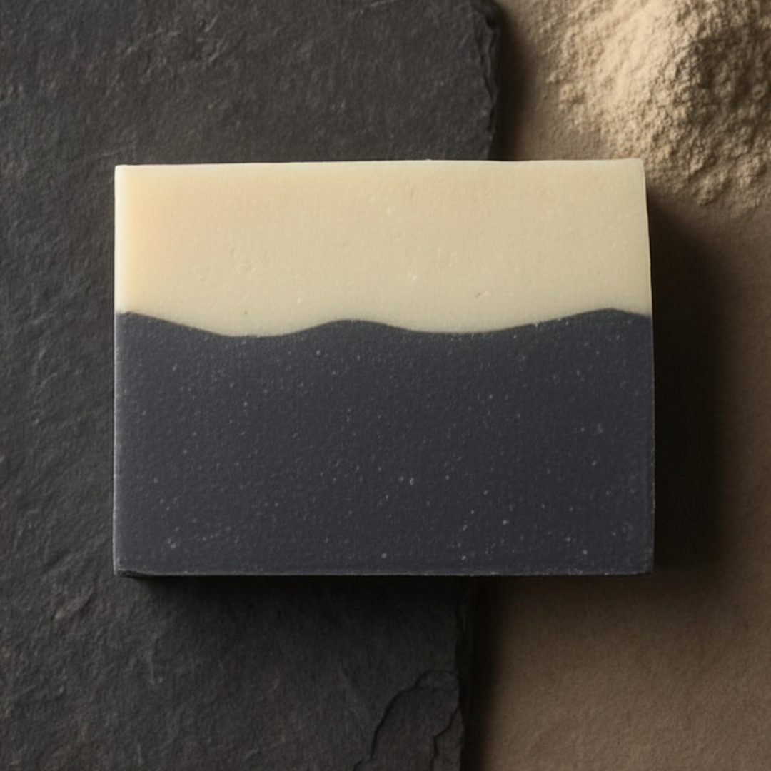 Two layered soap bar on a dark surface