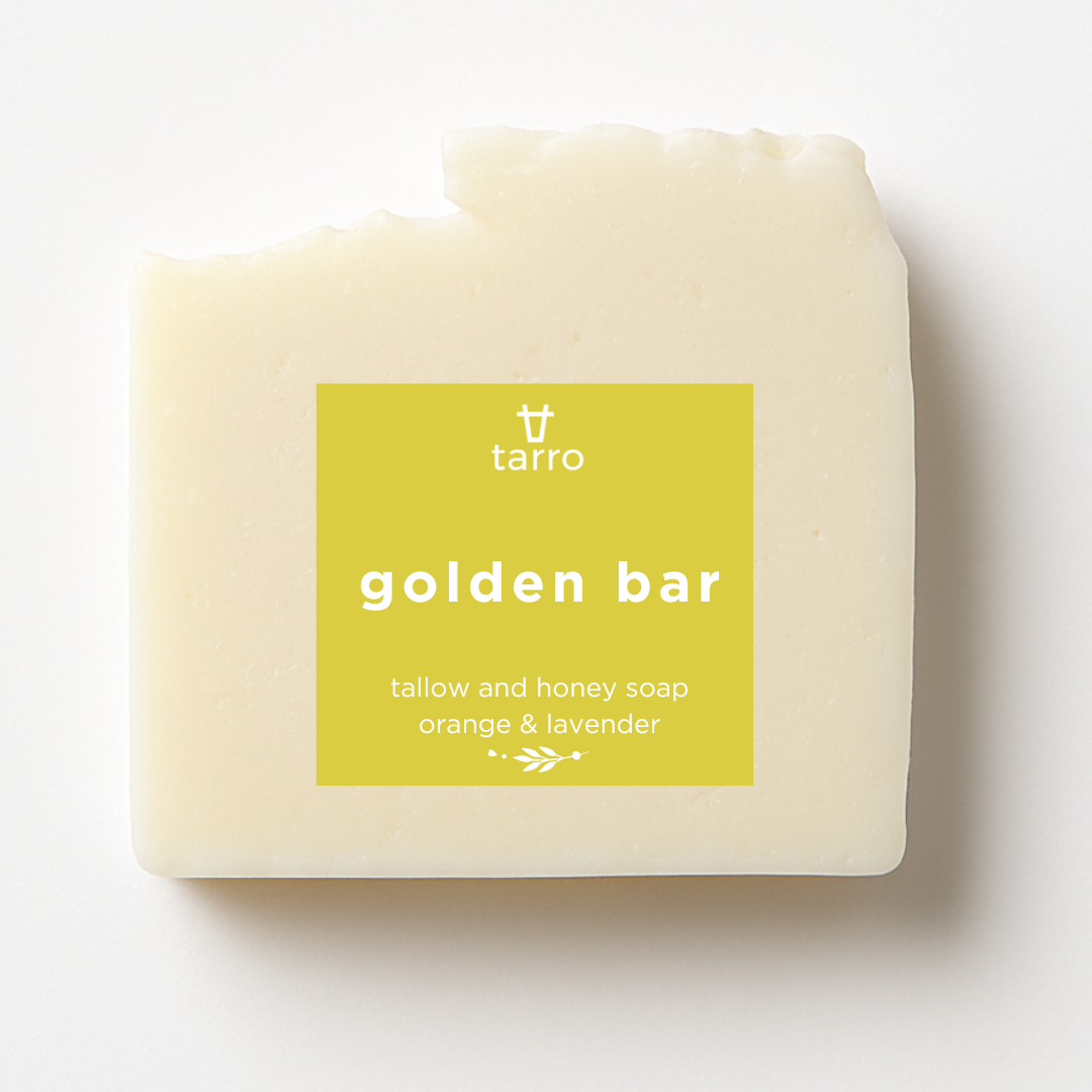 Tallow golden bar soap on a white background